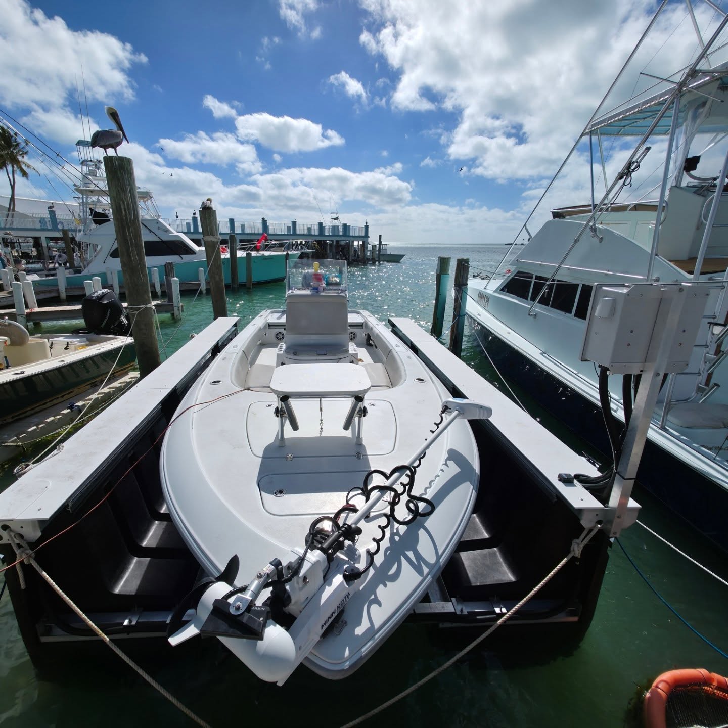 Center console on TideRider lift along a creek dock