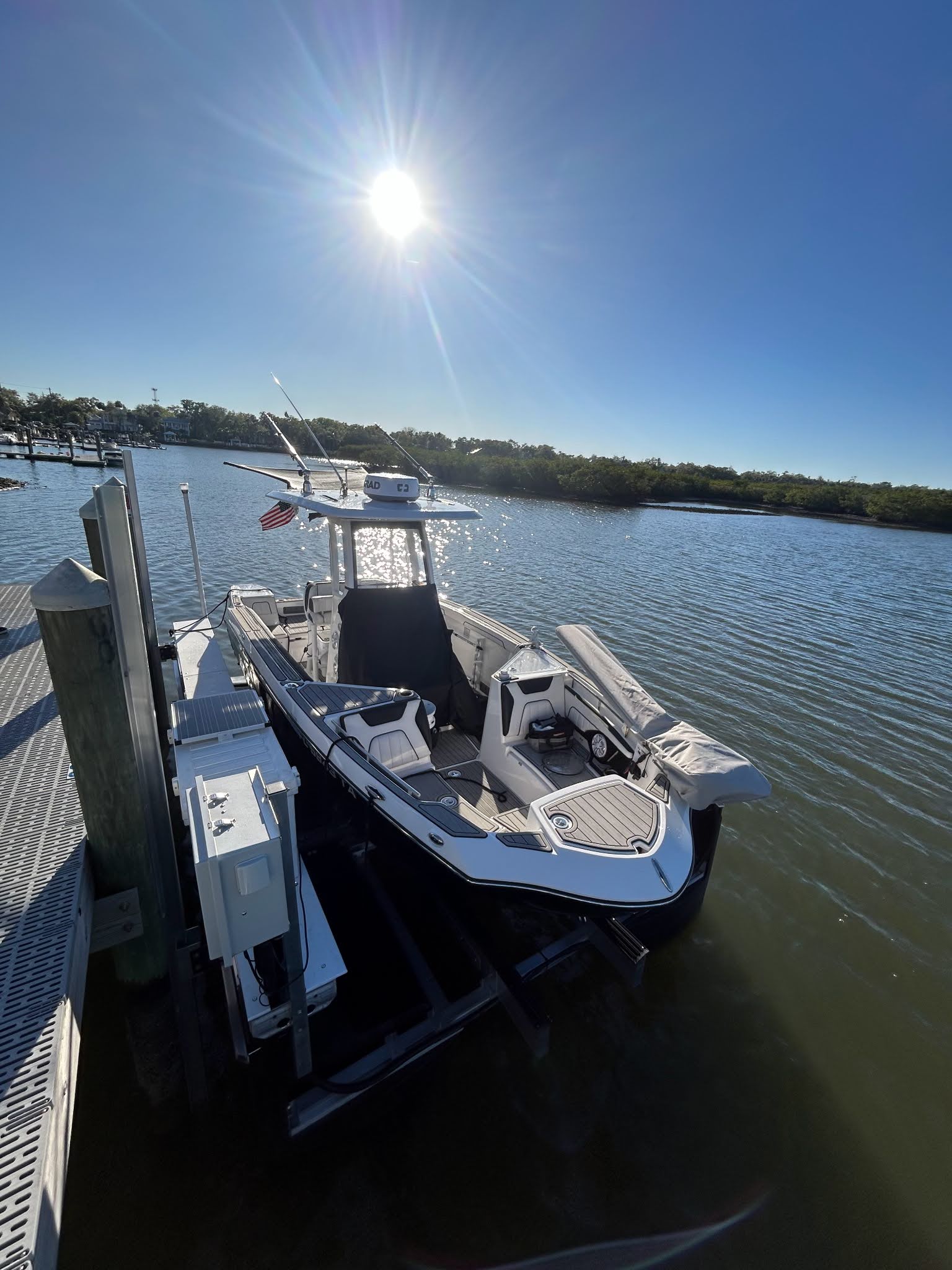 Boat lifted out of the water with full length walkways